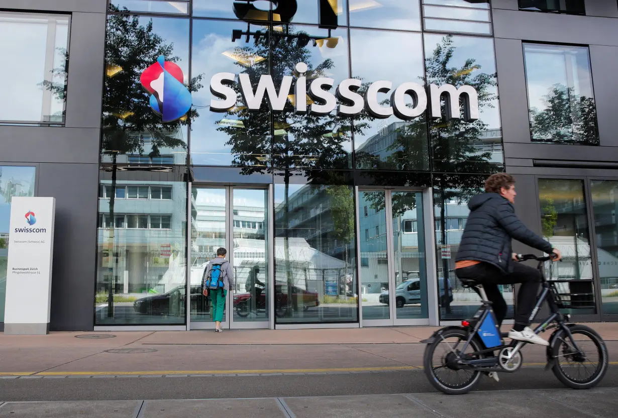 The logo of Swiss telecoms group Swisscom is seen at an office building ,in Zurich