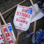 Boeing says it's considering temporary layoffs to save cash during the strike by machinists