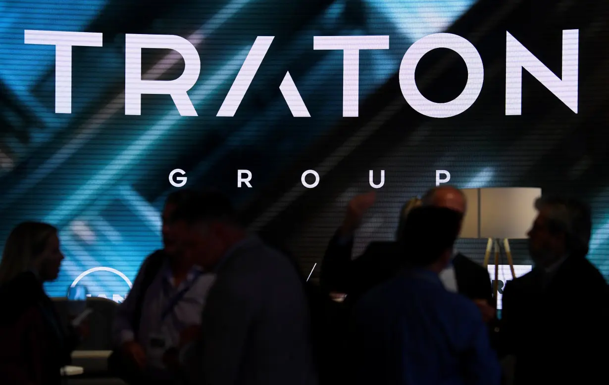 FILE PHOTO: Visitors stand at booth of VW's truck unit Traton Group in Hanover