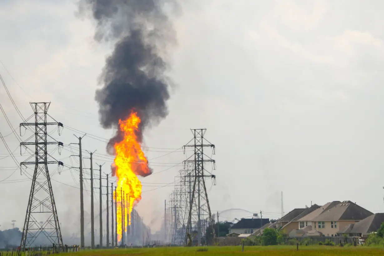 A pipeline fire has burned for hours and prompted evacuations in a Houston suburb