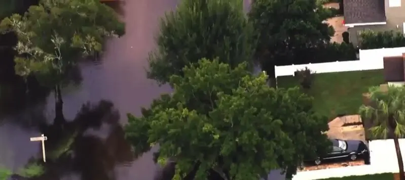 Woman plugged drain pipe with concrete causing neighborhood flooding. She has to pay daily fines or remove it