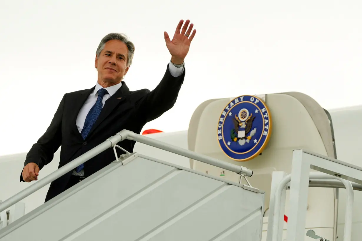 U.S. Secretary of State, Antony Blinken waves as he boards his plane at the Chopin Airport in Warsaw