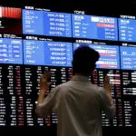 Asia shares tentative; dollar, yields squashed on outsized Fed cut bets