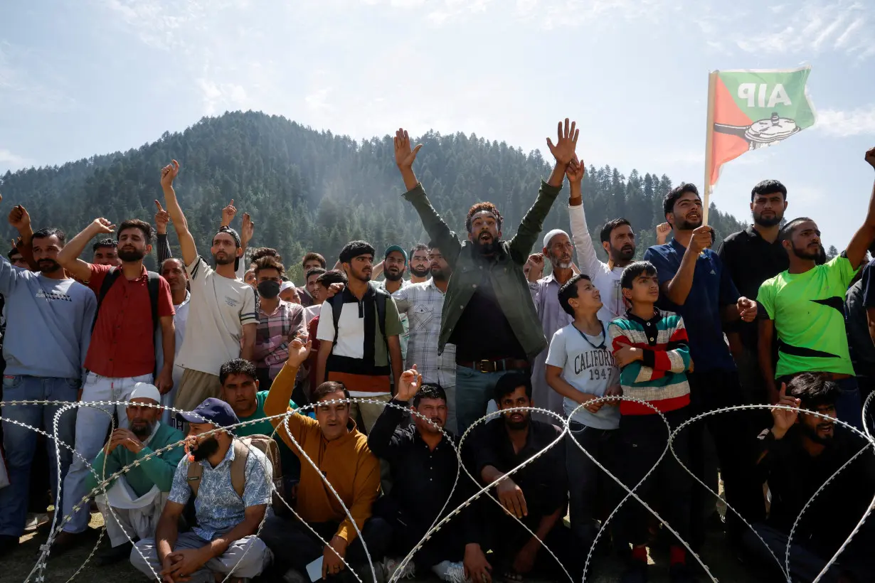 Supporters of Abdul Rashid Sheikh, leader of Awami Ittehad Party, attend an election campaign rally in North Kashmir's Kupwara district