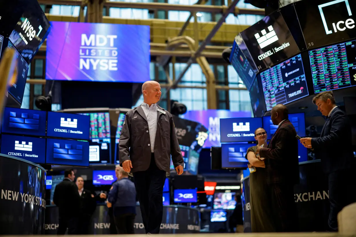 Traders work on the floor of the NYSE in New York