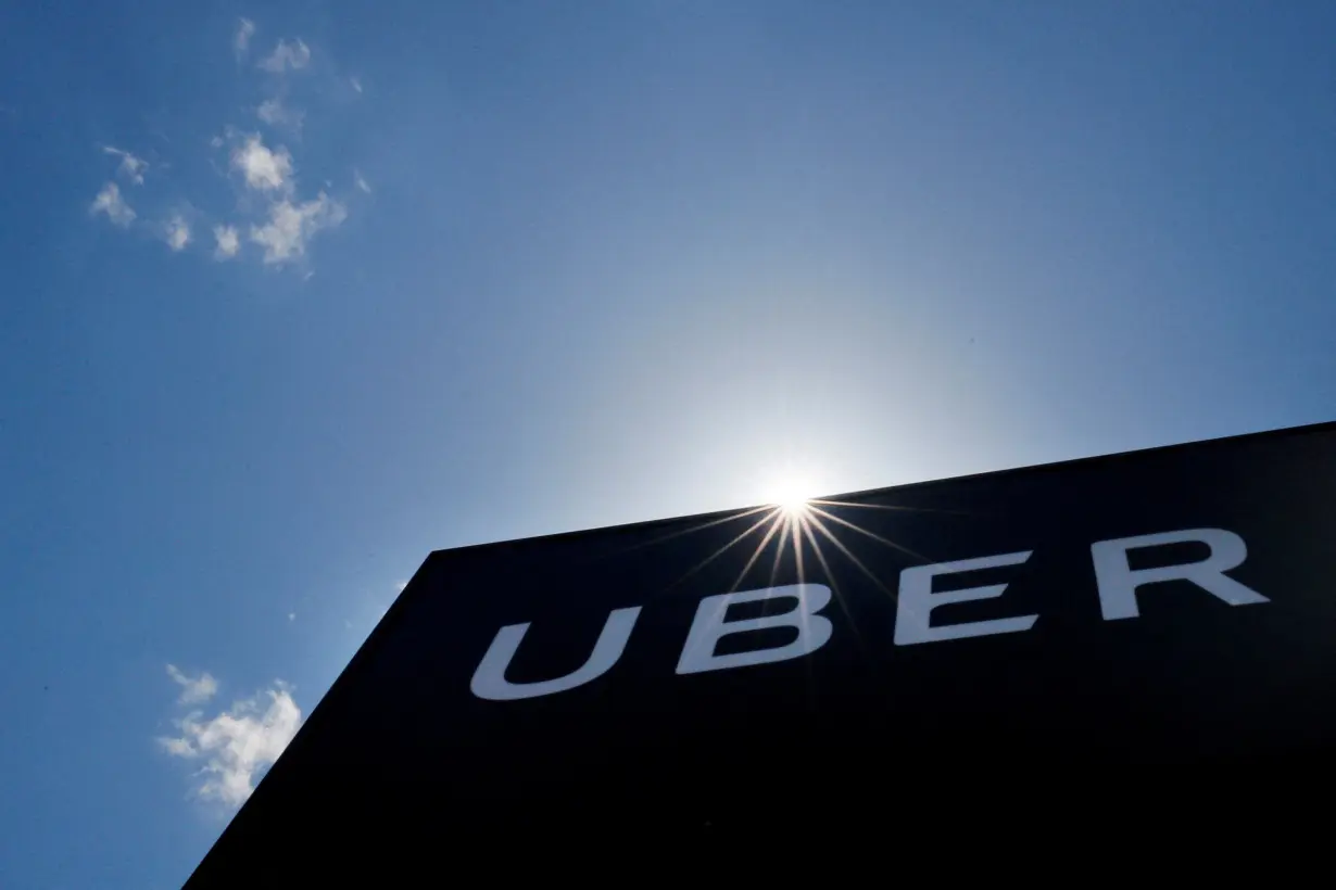 FILE PHOTO: A sign marks the offices of Uber in Saugus