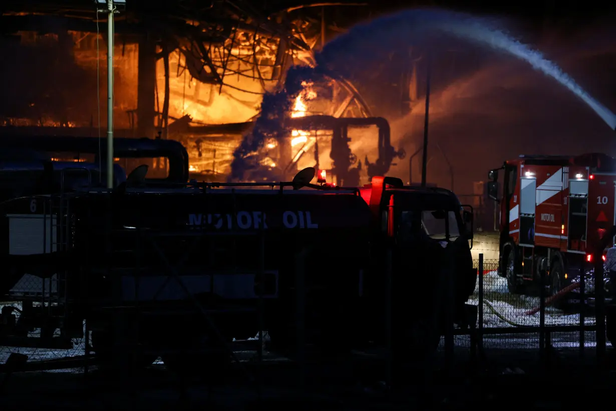 Flames rise as a fire burns at the Motor Oil refinery, in Agioi Theodoroi