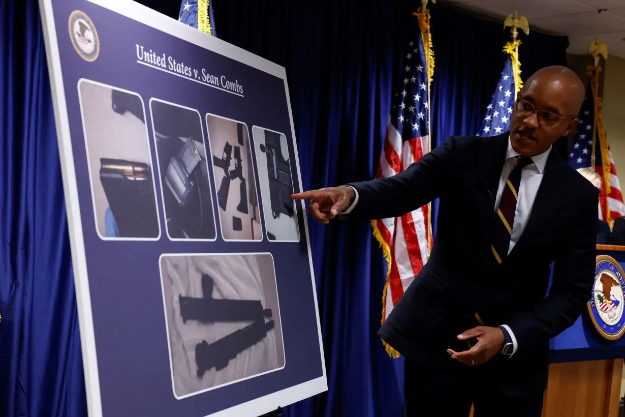 US Attorney Damian Williams pointed at a chart on September 17 showing the firearms seized during the search of Sean 