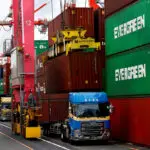 Japan's exports rise at slower pace, pressuring fragile economic recovery