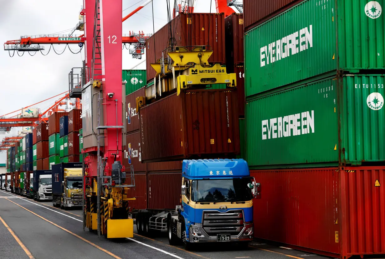 Stacked containers are seen at an industrial port in Tokyo