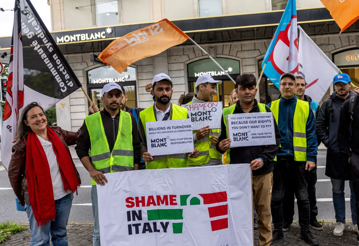 Italian contractors of Montblanc demonstrate outside the brand's shop in Geneva