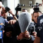 Malaysia charges man linked to Islamic firm in alleged child abuse scandal