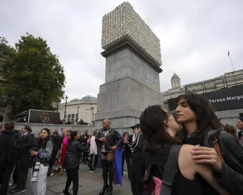 Faces of transgender people adorn an artwork in London's Trafalgar Square