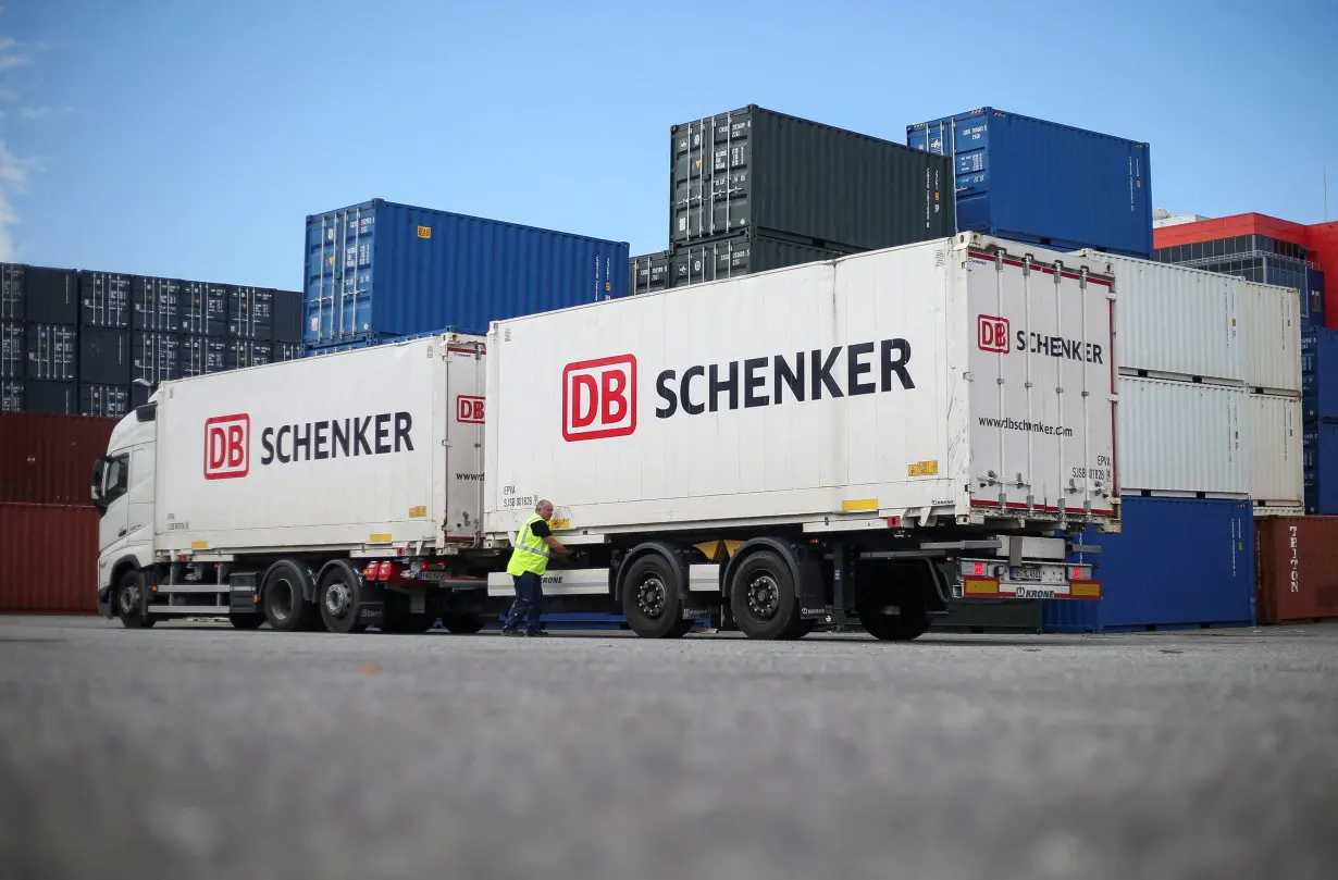 FILE PHOTO: DB Schenker trucks are seen during a press tour of Deutsche Bahn's logistics unit Schenker at the harbour in Hamburg