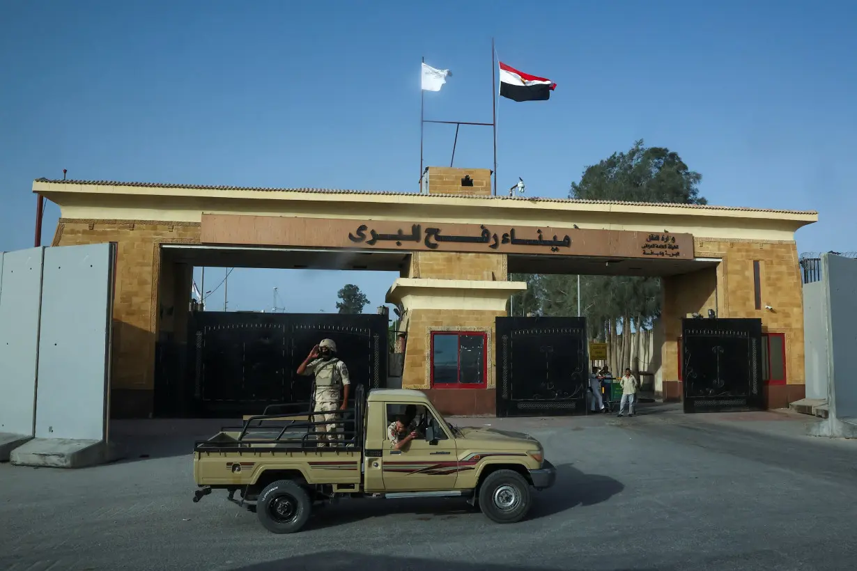 Egyptian soldiers stand guard near the Rafah Crossing at the Egypt-Gaza border, in Rafah