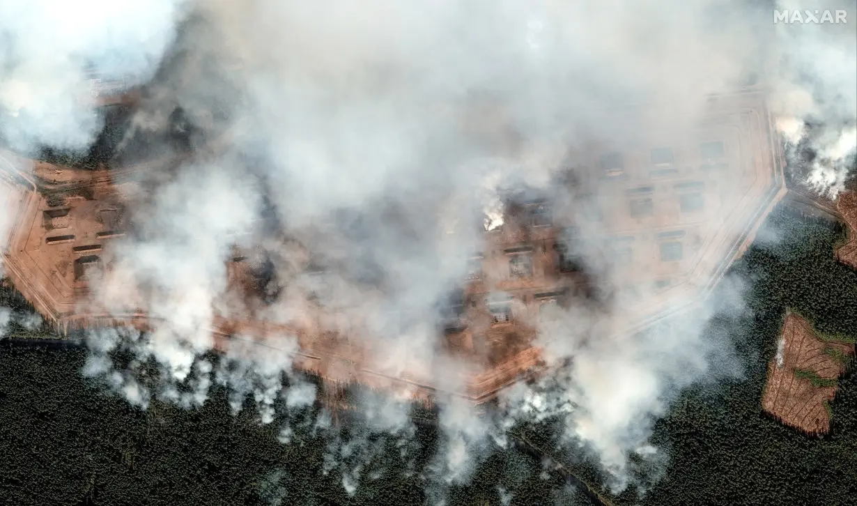 A satellite image shows ammunition bunkers on fire after the explosion, in Toropets