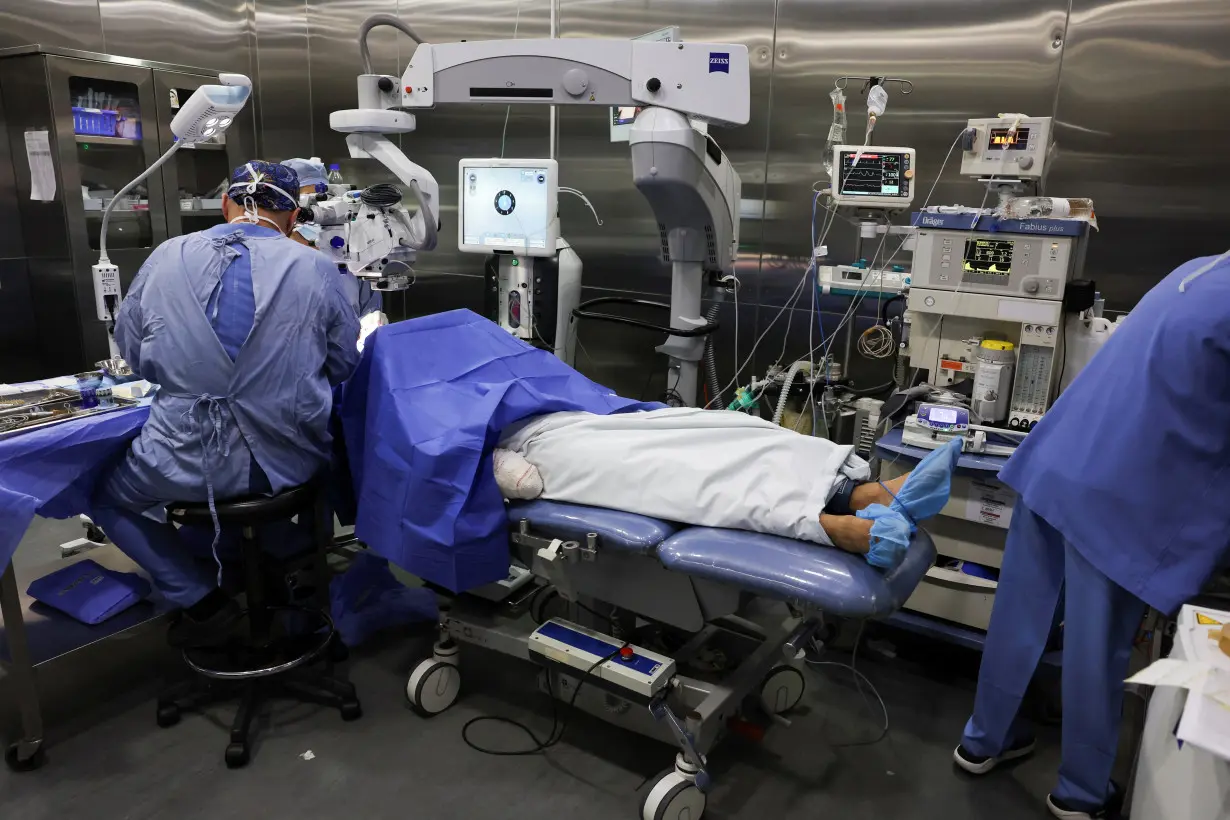 An injured man undergoes an operation, following pager detonations across Lebanon, at a hospital in Beirut