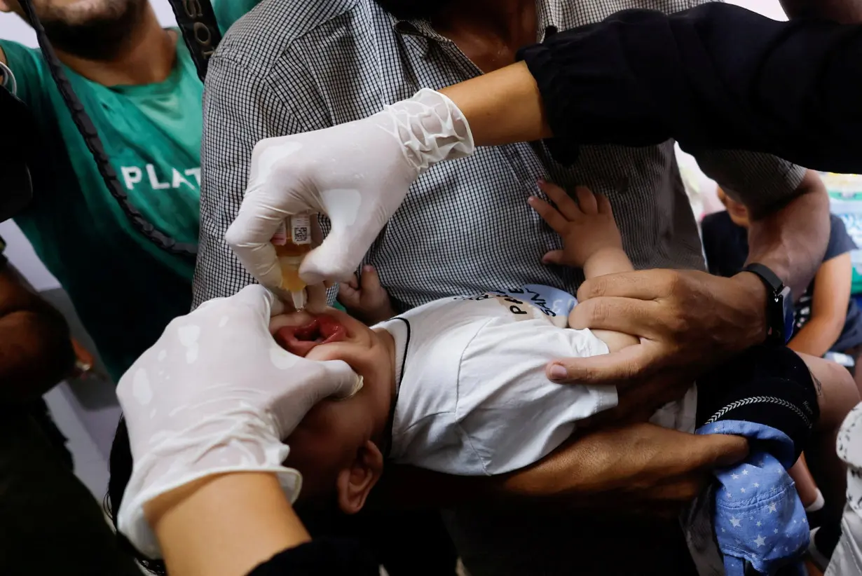 FILE PHOTO: Palestinian children are vaccinated against polio, at Nasser hospital in Khan Younis