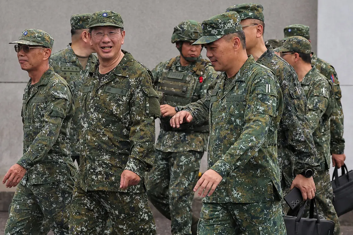 FILE PHOTO: Defence Minister Wellington Koo inspects troops during a live fire exercise at the Fangshan training grounds in Pingtung