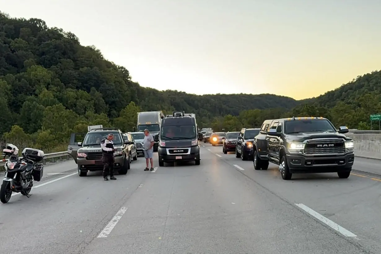 Drivers park on the the lanes of the I-75 highway after reports of multiple people shot in Kentucky