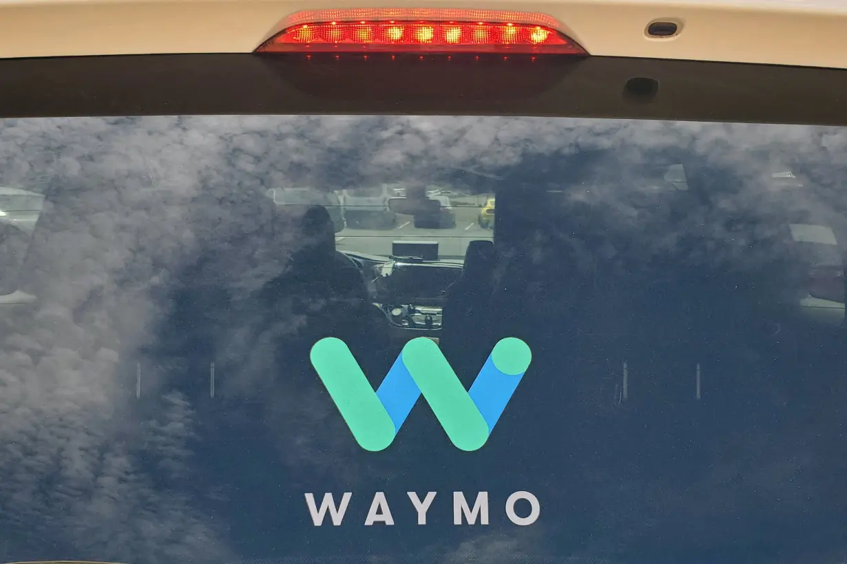 FILE PHOTO: Rear window of a Waymo Chrysler Pacifica robotaxi is seen while parked in Tempe