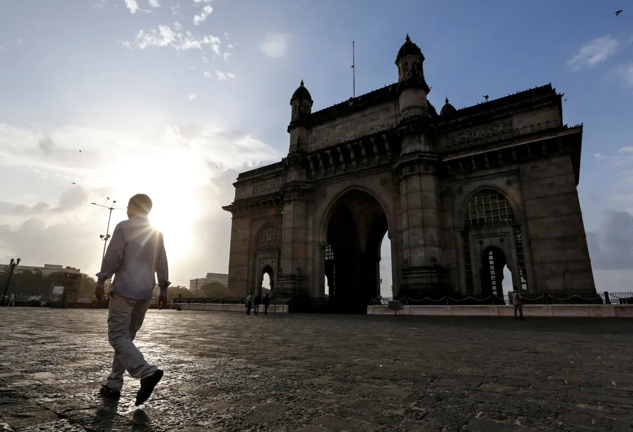 FILE PHOTO: FILE PHOTO: People visit Gateway of India along the Arabian sea in Mumbai