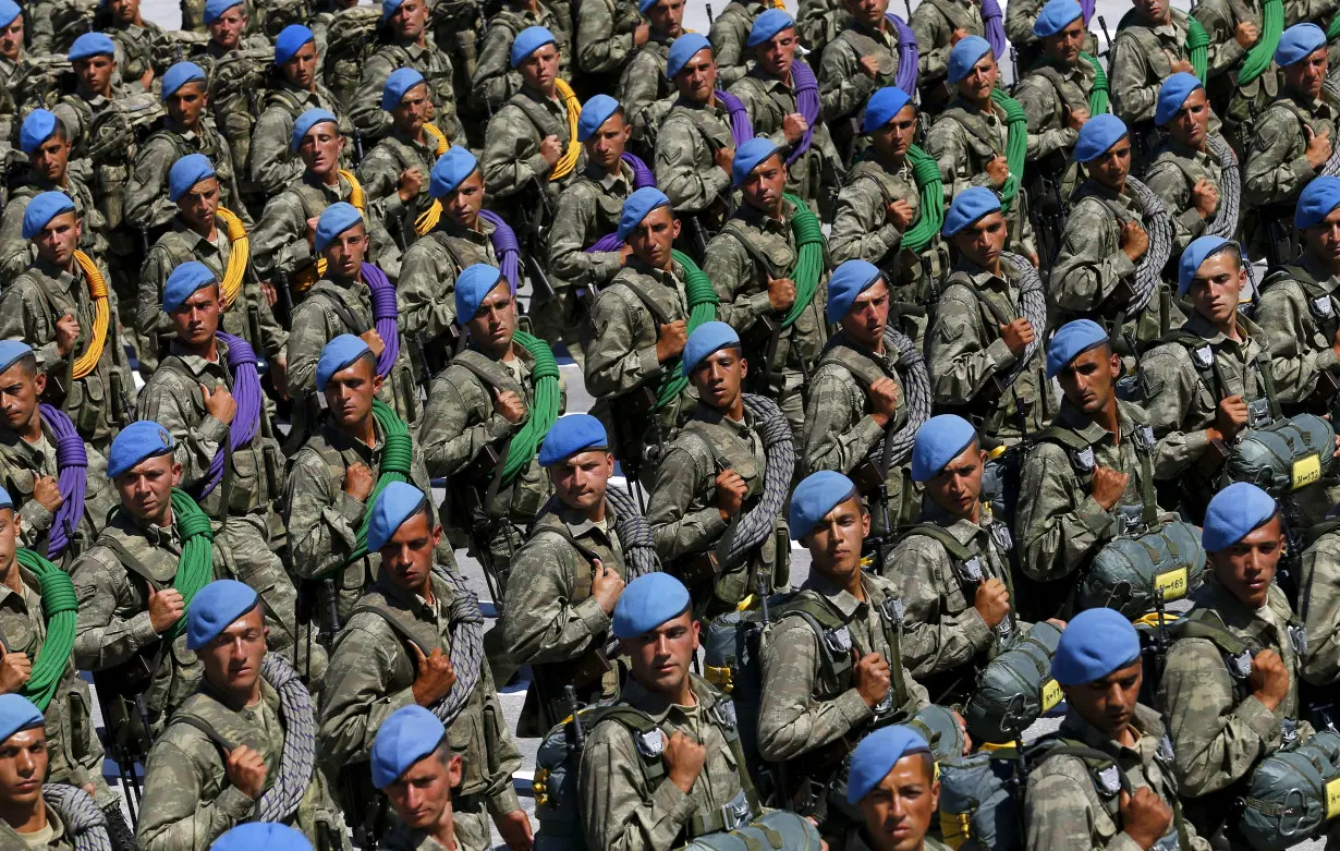 FILE PHOTO: Turkish soldiers march during a parade marking the 93rd anniversary of Victory Day in Ankara