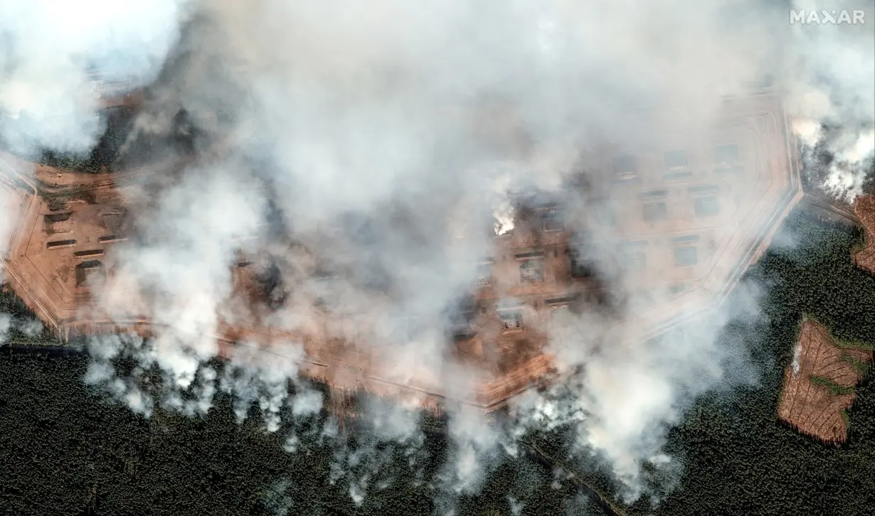 A satellite image shows ammunition bunkers on fire after the explosion, in Toropets