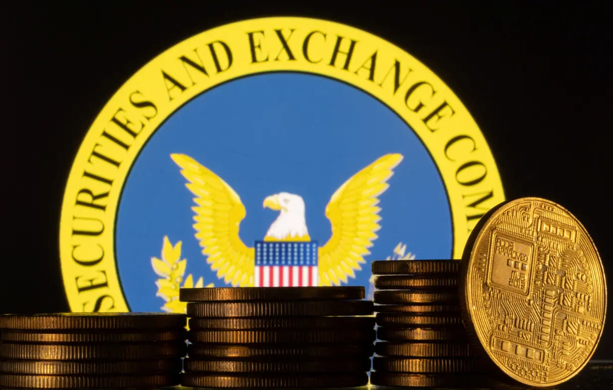 Illustration shows U.S. Securities and Exchange Commission logo and representations of cryptocurrency