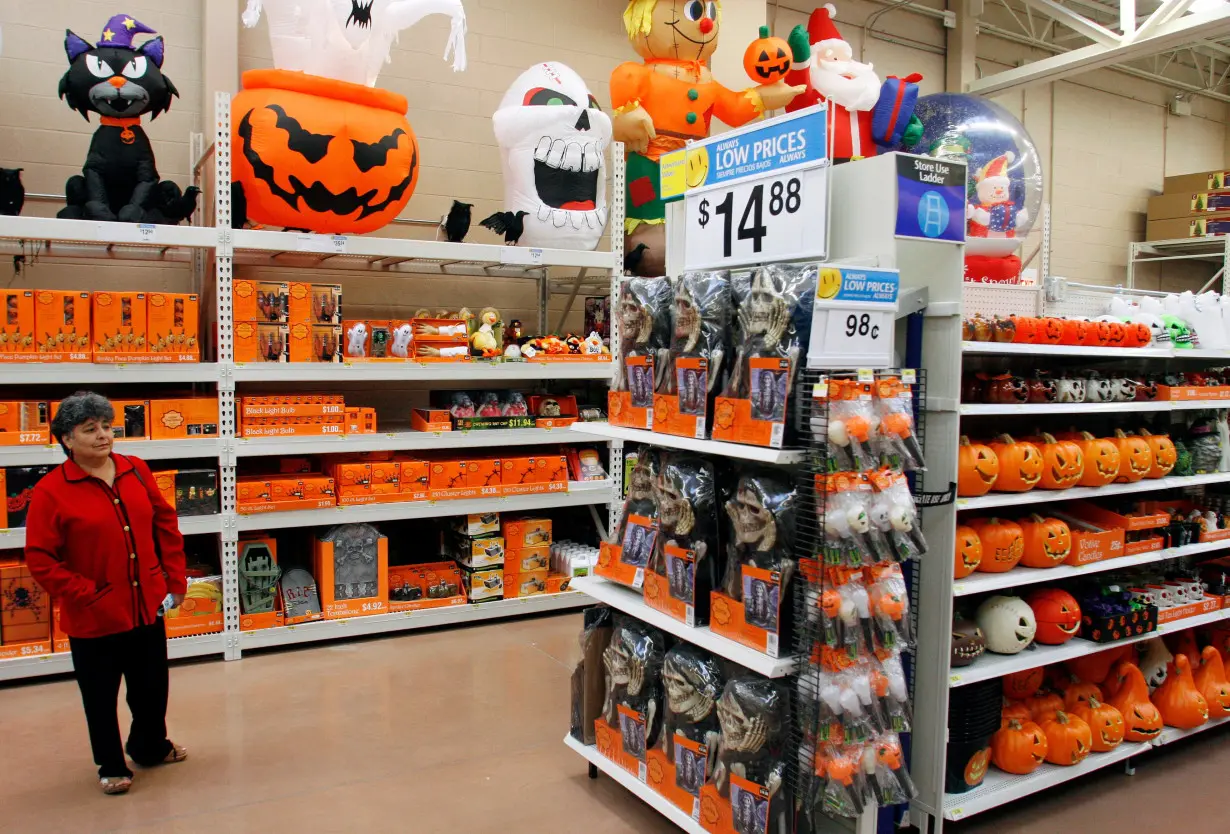 Avilia Palenca looks at Halloween merchandise at the new 142,000 square foot Wal-Mart during the grand opening