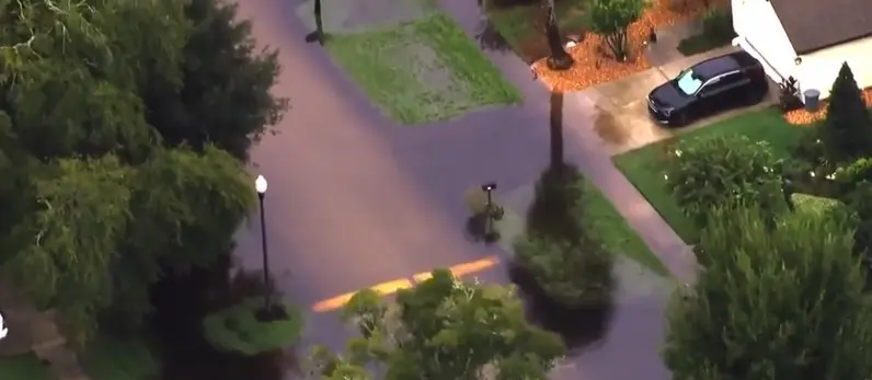 Woman plugged drain pipe with concrete causing neighborhood flooding. She has to pay daily fines or remove it