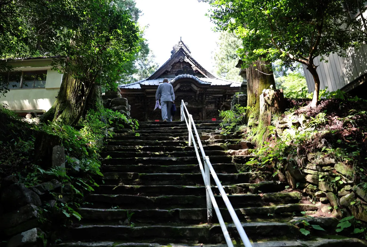 A buddhist monk Benmou Suzuki makes his way to Mikaboyama Fudoson temple in Fujioka