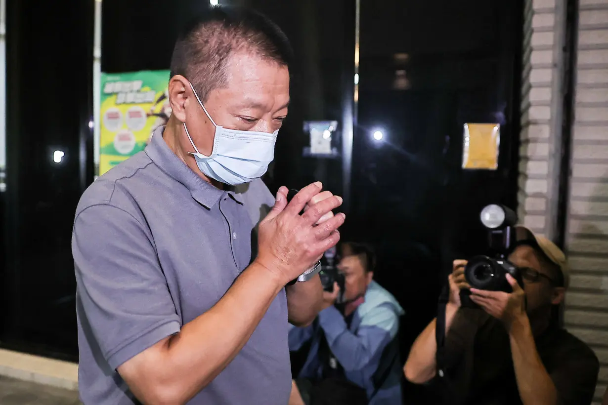 Hsu Ching-kuang, founder and president of Gold Apollo, arrives at Taiwan Shilin District Prosecutors Office in Taipei