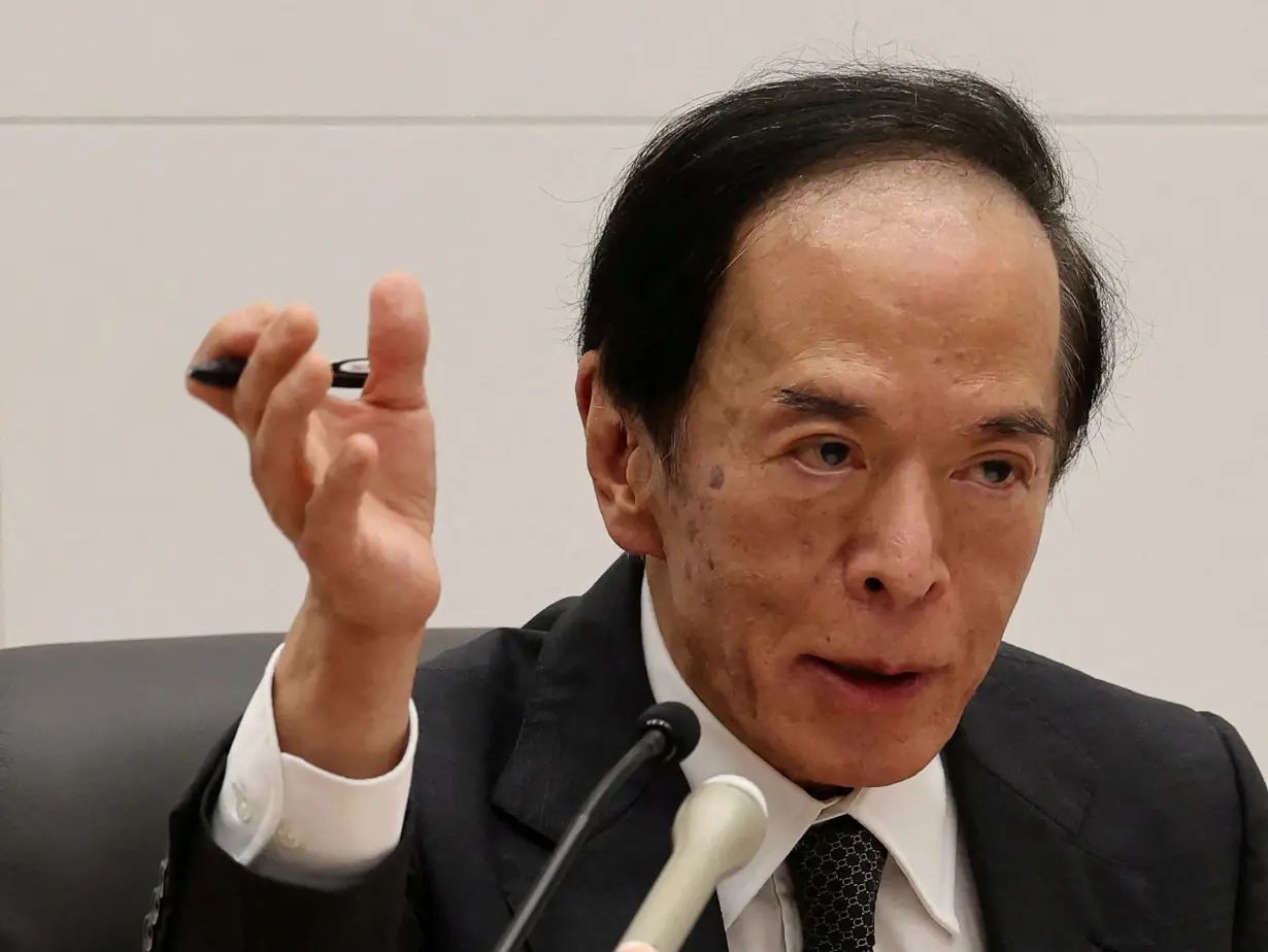 FILE PHOTO: Bank of Japan Governor Kazuo Ueda attends a press conference after its policy meeting in Tokyo