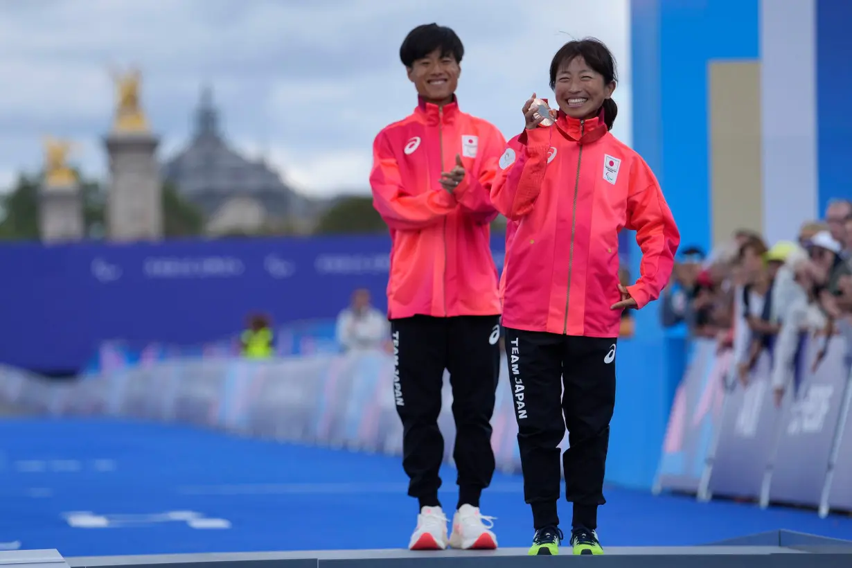 Japan's Misato Michishita poses with her bronze medal after the race.