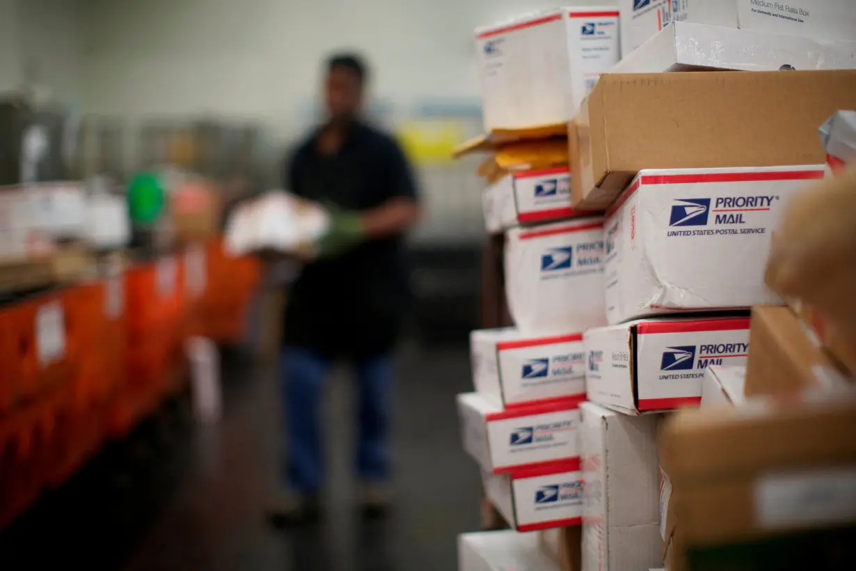 FILE PHOTO: United States Postal Service clerks sort mail at the USPS Lincoln Park carriers annex in Chicago