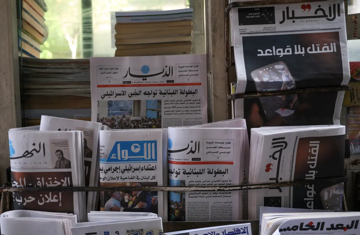 A newsstand shows headlines following pager detonations across Lebanon, in Beirut