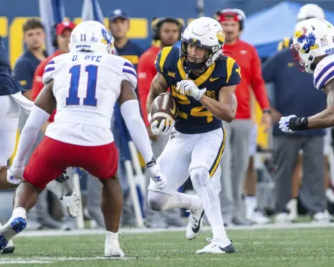 Garrett Greene throws two late TD passes and West Virginia beats Kansas 32-28