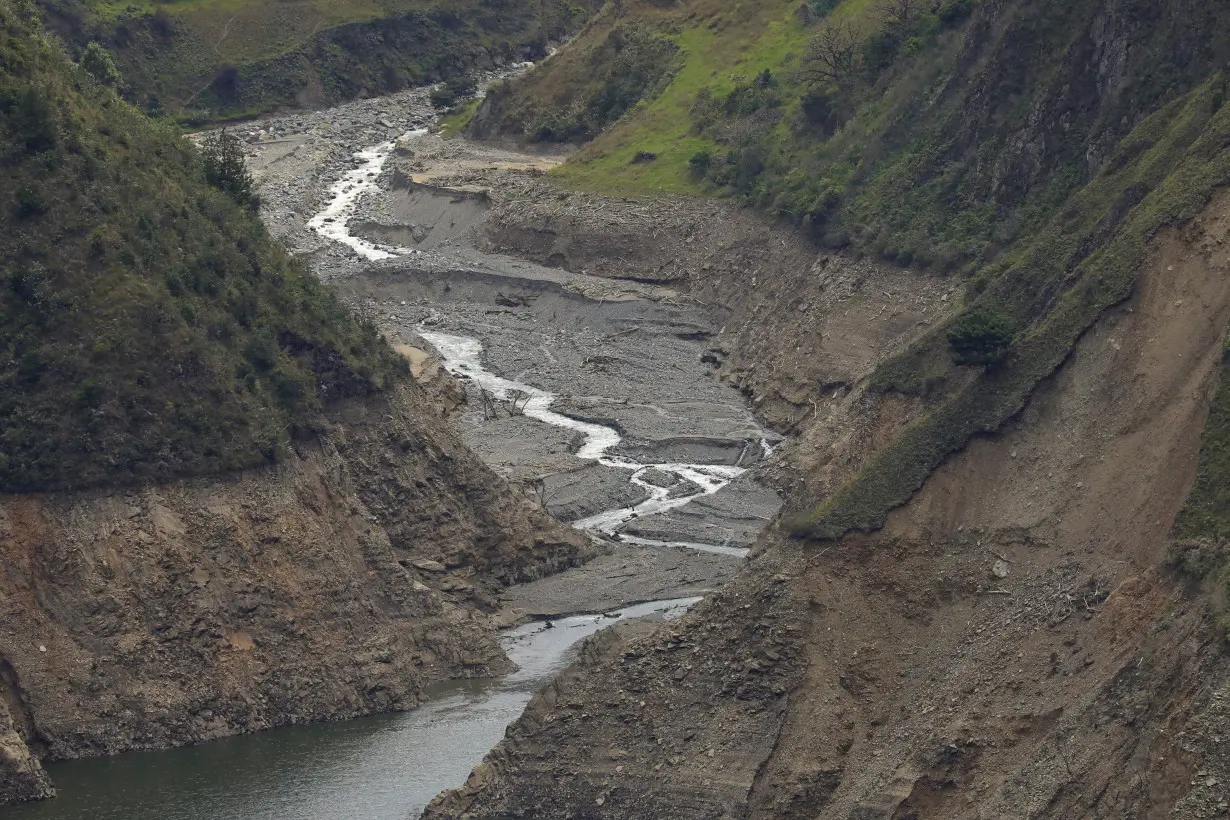 FILE PHOTO: A view shows a small stream that feeds the Paute river, affected by a severe drought, in Paute