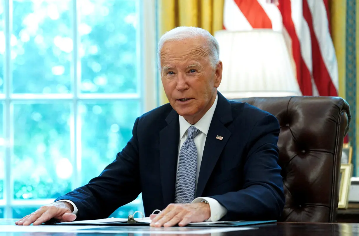 FILE PHOTO: U.S. President Joe Biden speaks to reporters at the White House in Washington