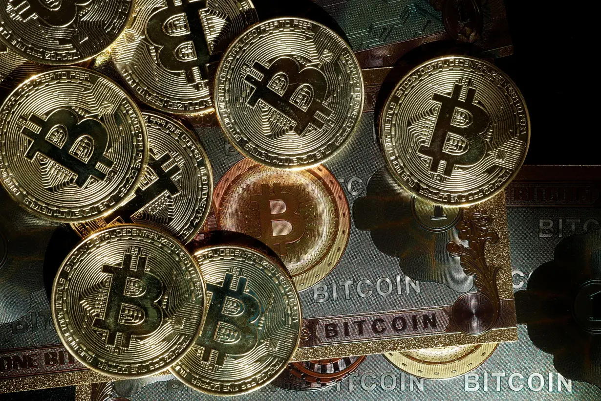 Illustration shows representations of cryptocurrency Bitcoin