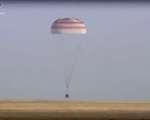 A Soyuz capsule with 2 Russians and 1 American from the International Space Station returns to Earth
