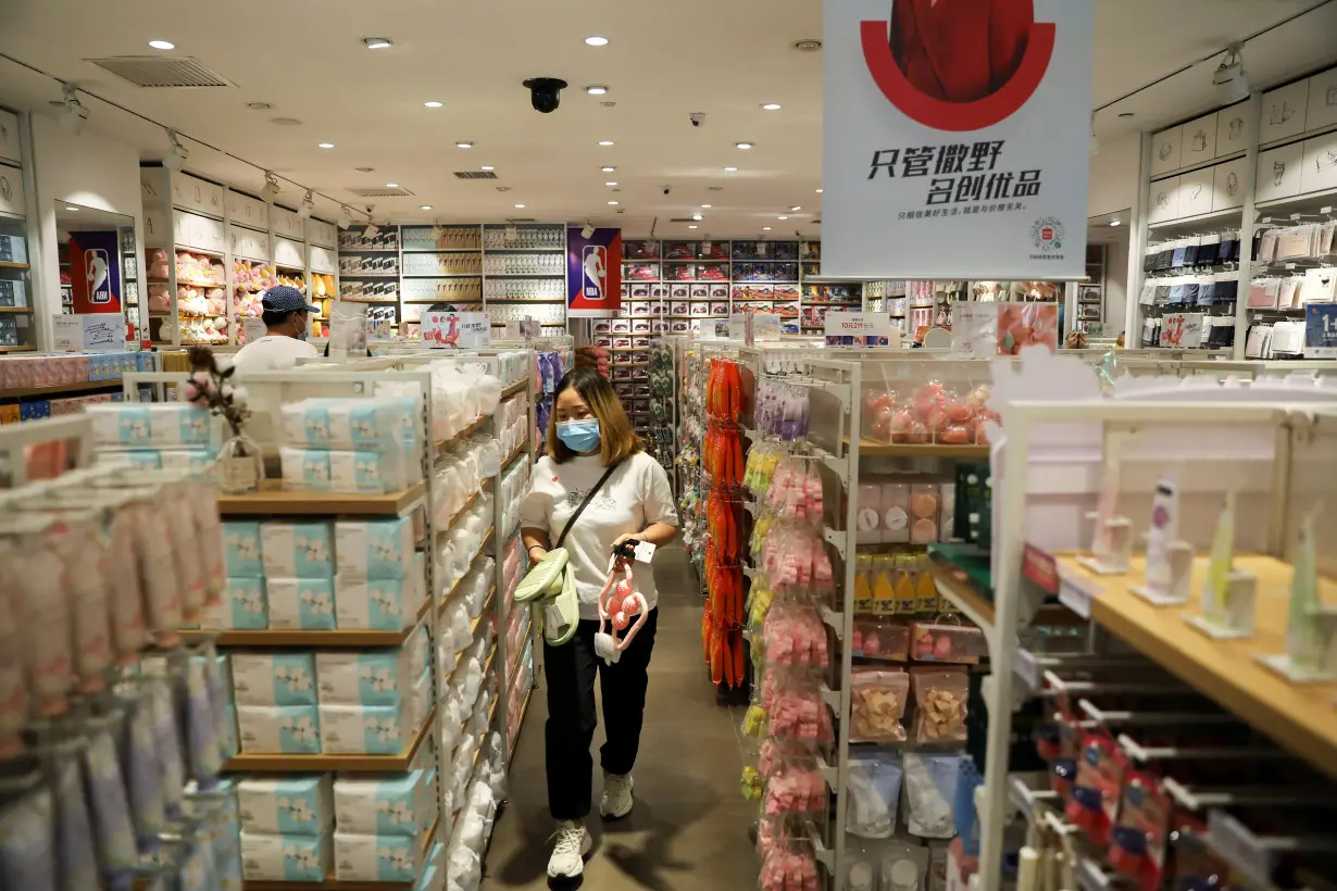 Customer shops at a store of Chinese retailer MINISO Group in Beijing