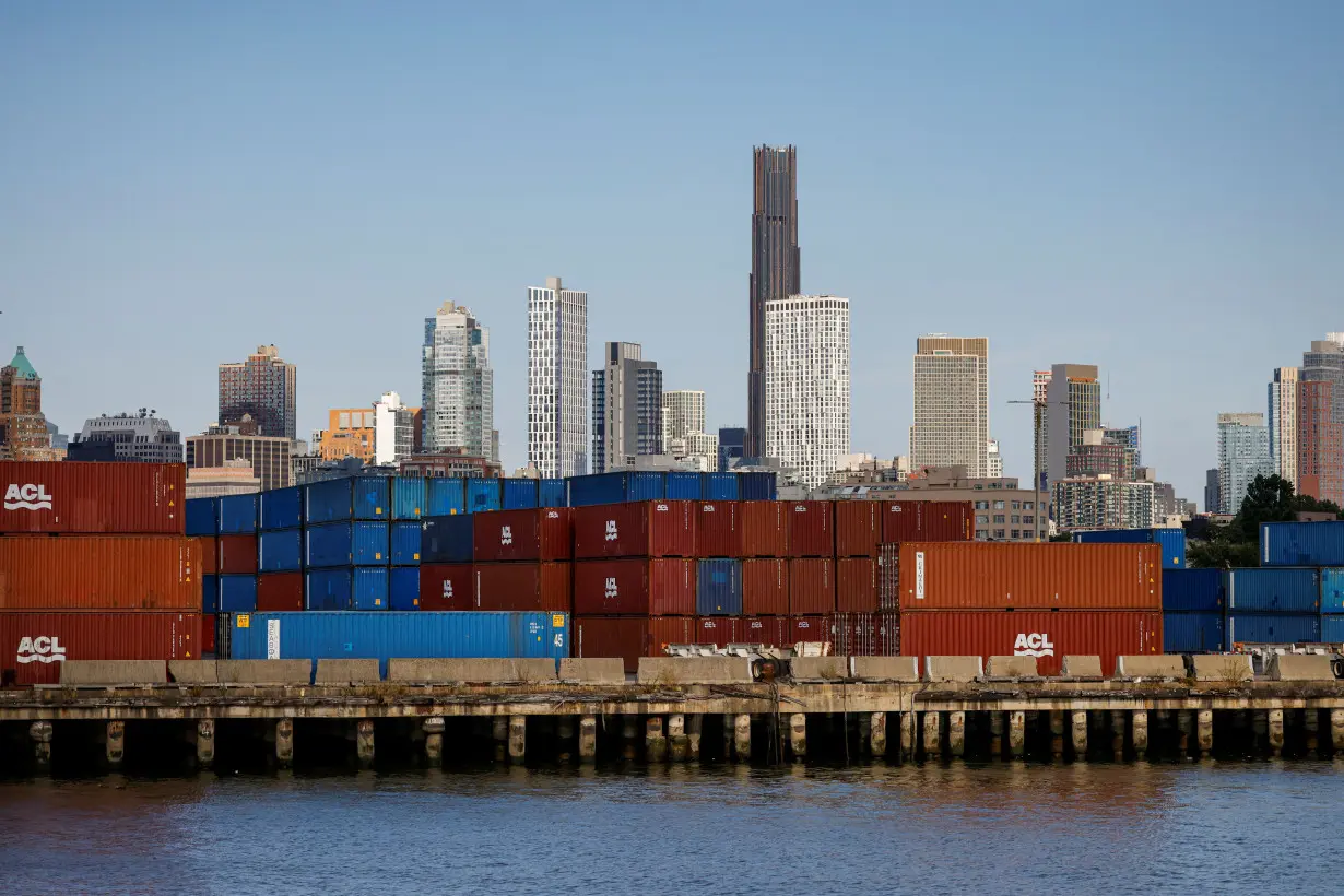 Shipping containers are stacked on a pier at the Red Hook Terminal in Brooklyn, New York