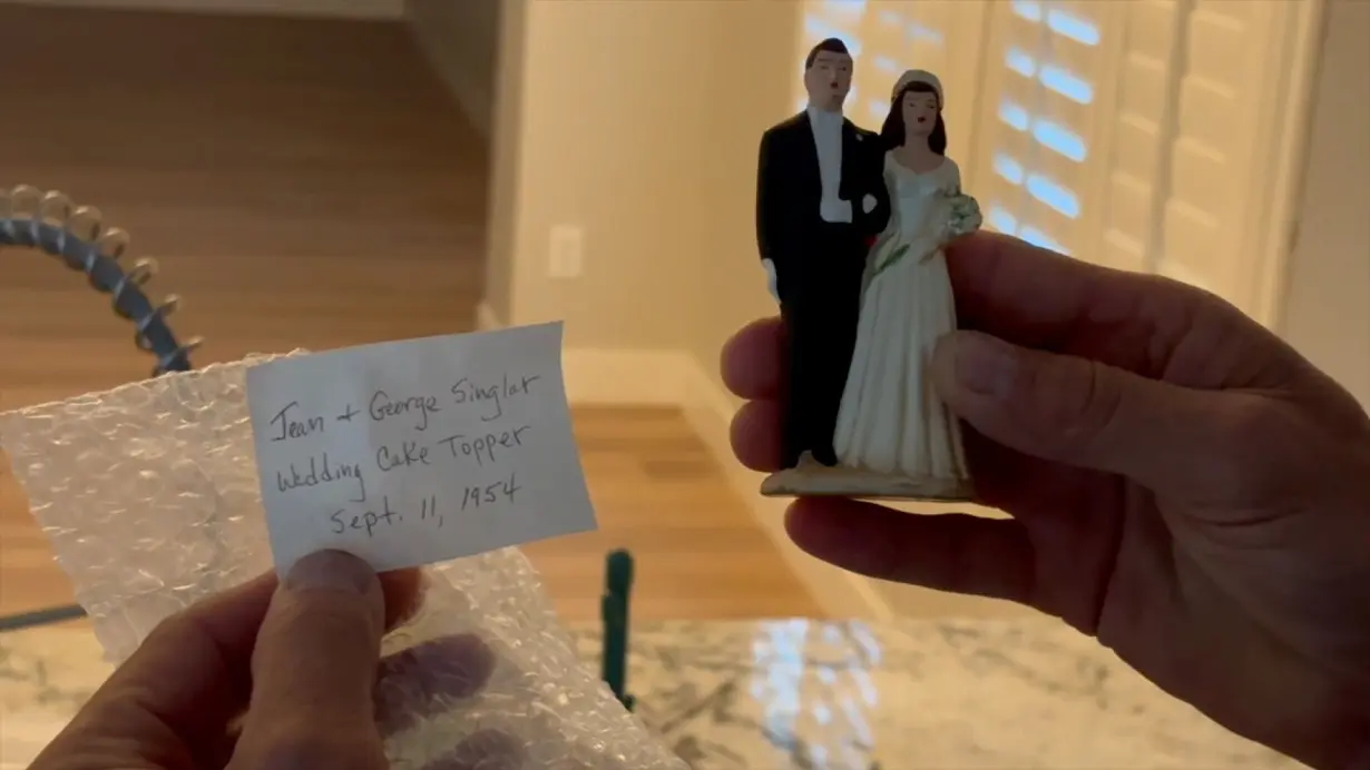 Decades-old wedding cake topper found in Chandler home, reunited with family