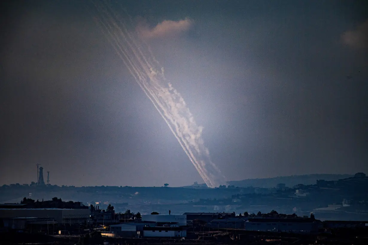 Rockets are launched from Lebanon towards Israel, as seen from northern Israel