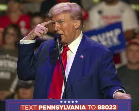 Trump listens during a farming event in rural Pennsylvania, then threatens John Deere with tariffs