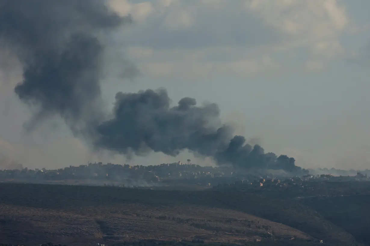 Smoke billows over southern Lebanon following Israeli strikes, as seen from Tyre, southern Lebanon