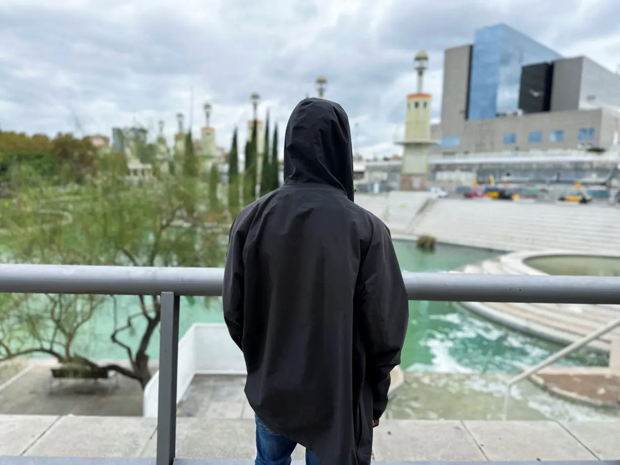 A migrant from Mali speaks to Reuters journalist in Barcelona