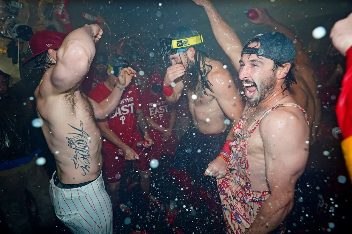 Philadelphia Phillies players celebrate winning the National League East Division title.